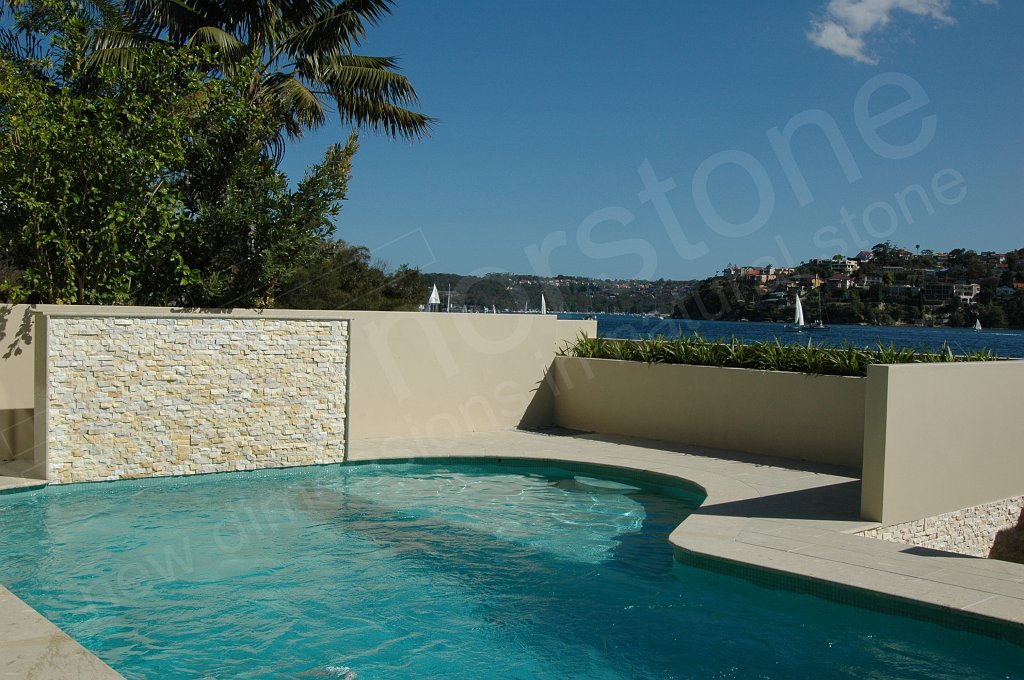 A pool feature wall of stacked stone that should be sealed